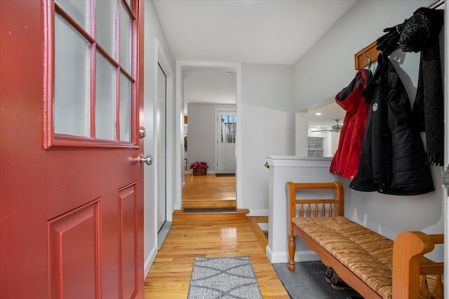 mudroom with light wood-type flooring and baseboards