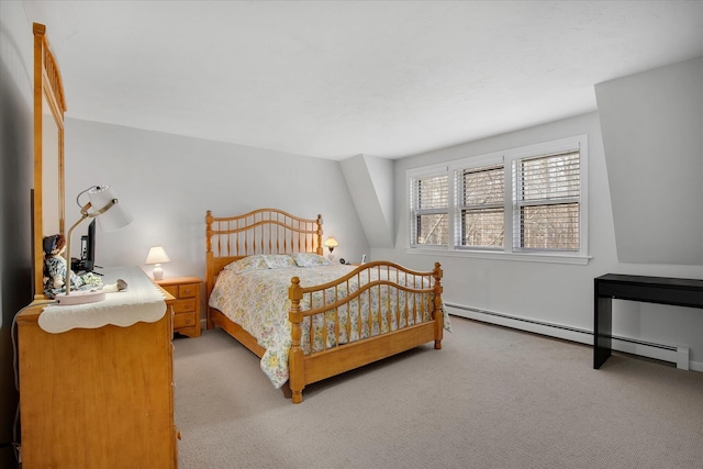 bedroom with a baseboard radiator and light carpet