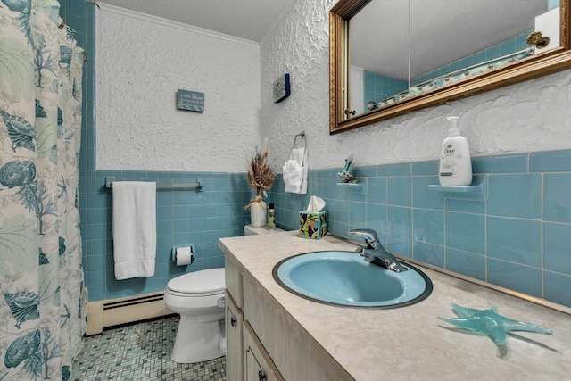 bathroom with tile walls, vanity, ornamental molding, a baseboard radiator, and tile patterned floors