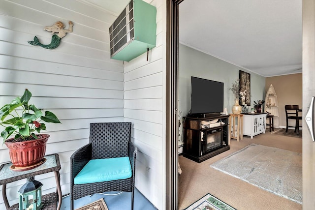 interior space featuring ornamental molding and carpet floors