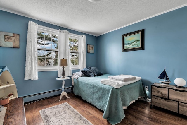 bedroom with dark wood-type flooring, ornamental molding, a textured ceiling, and baseboard heating