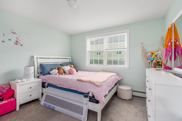 carpeted bedroom with a baseboard radiator