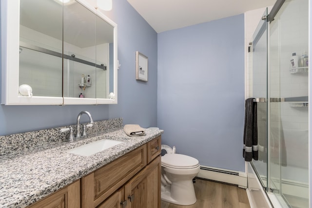 bathroom featuring a baseboard radiator, a shower with door, hardwood / wood-style flooring, toilet, and vanity