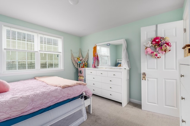 bedroom with light colored carpet