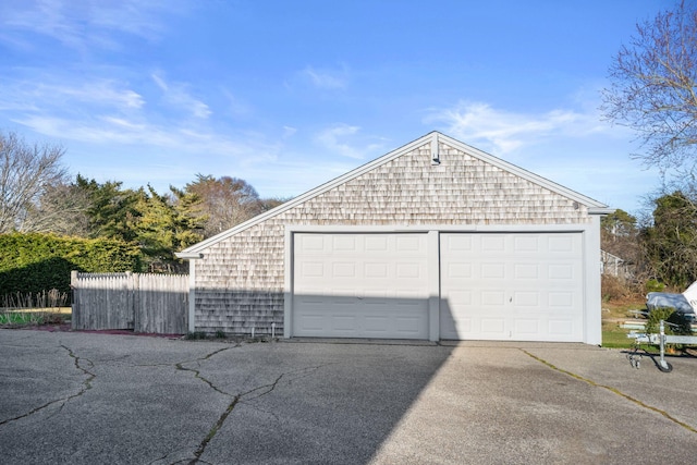 detached garage with fence