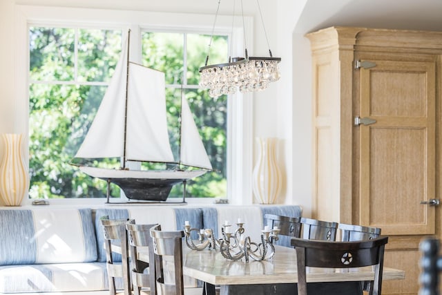 dining area featuring an inviting chandelier