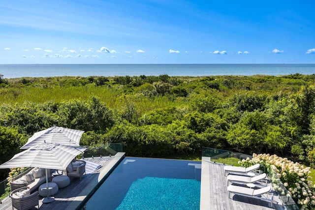 view of pool with a water view and an infinity pool