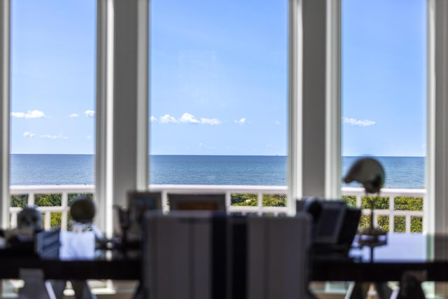 dining space featuring a water view
