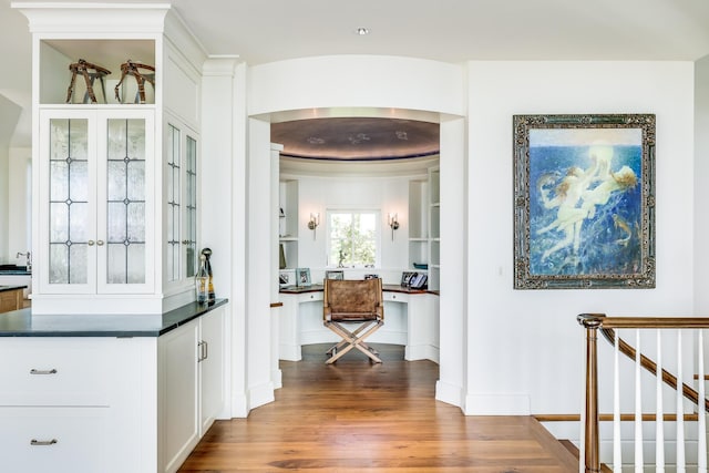corridor featuring wood finished floors