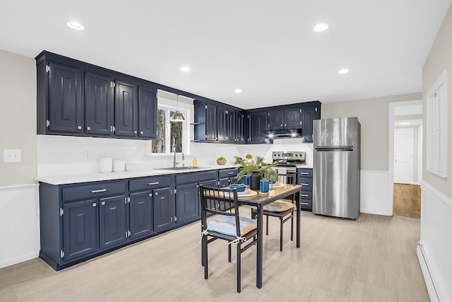 kitchen with baseboard heating, light hardwood / wood-style flooring, sink, blue cabinets, and stainless steel appliances