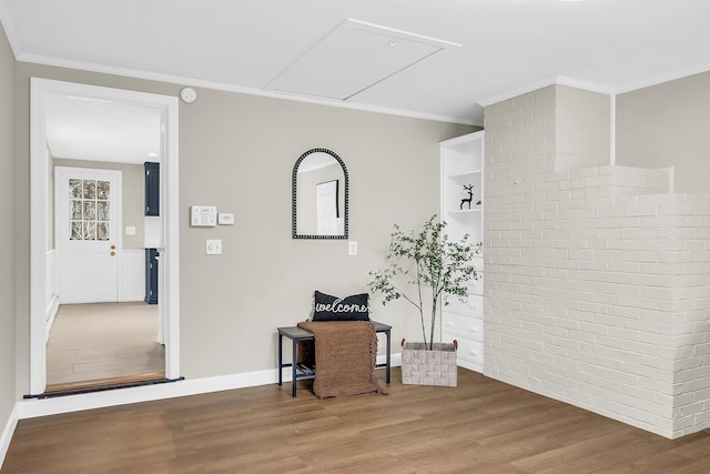 hall with hardwood / wood-style flooring and ornamental molding