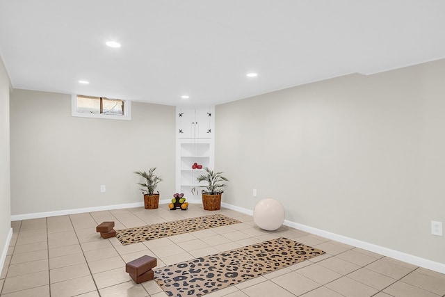 exercise area with light tile patterned floors