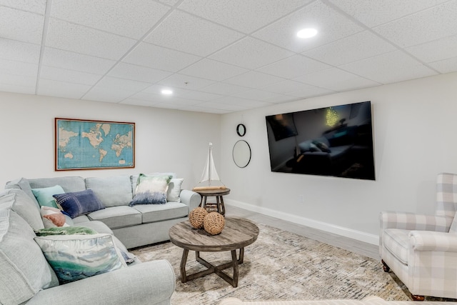 living area featuring recessed lighting, baseboards, and wood finished floors