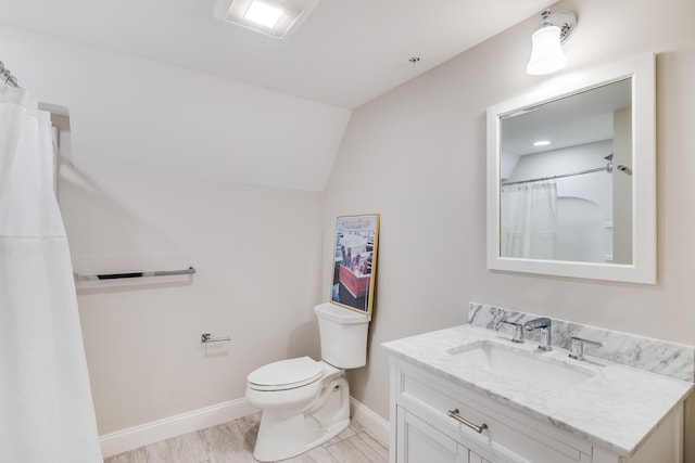 bathroom with baseboards, toilet, curtained shower, vaulted ceiling, and vanity