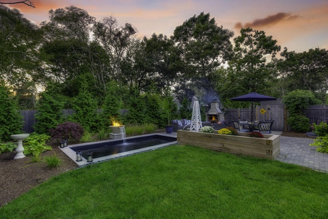 exterior space featuring a fenced backyard and a yard