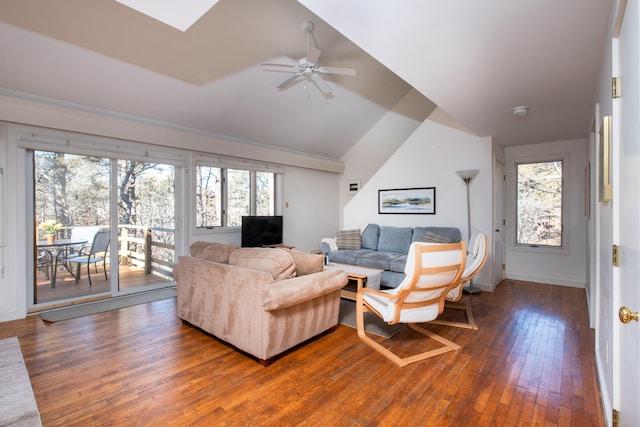 living room featuring lofted ceiling, ceiling fan, hardwood / wood-style flooring, and baseboards