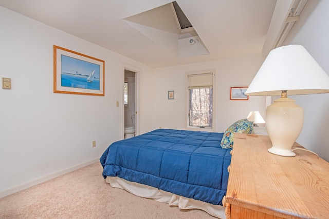 bedroom with carpet floors and baseboards