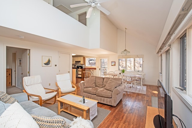 living room with high vaulted ceiling, ceiling fan, baseboards, and dark wood finished floors