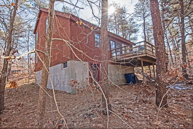 view of home's exterior featuring a wooden deck