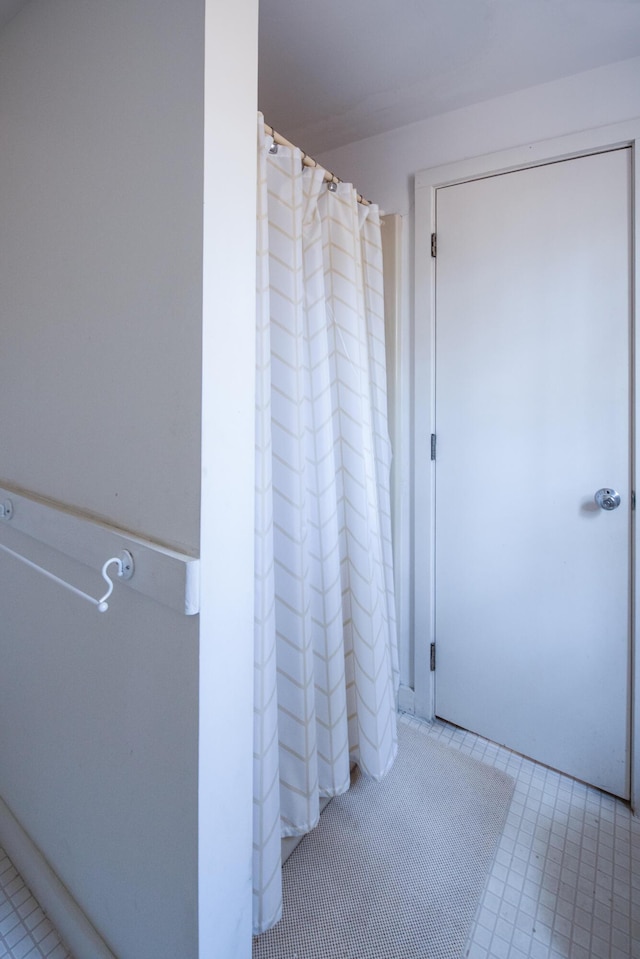 bathroom with tile patterned flooring