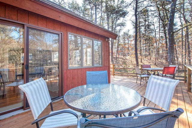 wooden deck with outdoor dining space