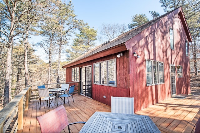 wooden deck featuring outdoor dining area