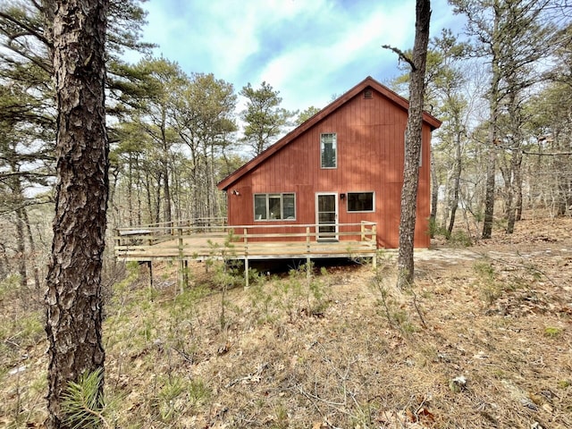 rear view of house with a wooden deck