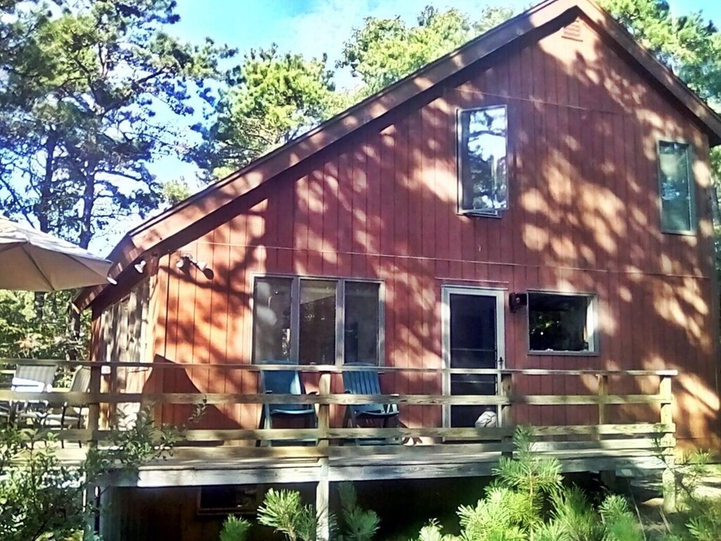 back of house with a wooden deck