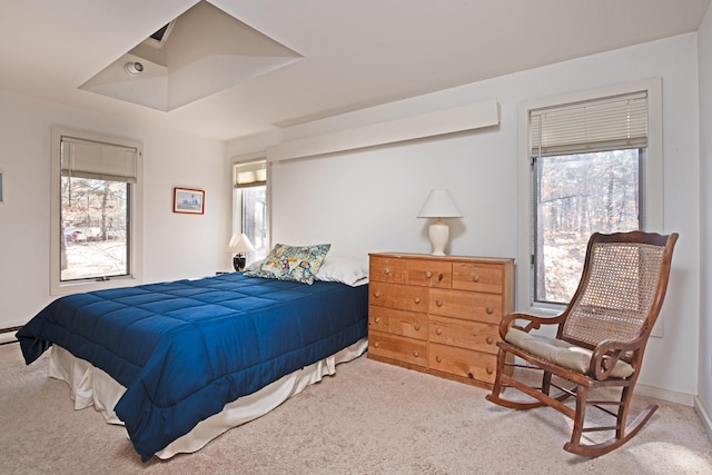 bedroom featuring light carpet