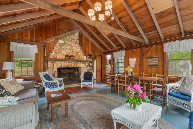 92 John Joseph Rd, Harwich, MA 02645 - living room with plenty of natural light, wood ceiling, wood walls, a stone fireplace, and a chandelier