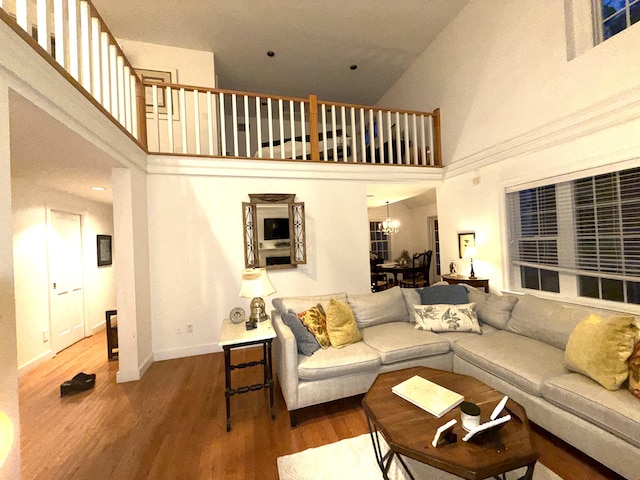 15 Hampton Ct, Mashpee, MA 02649 - living area with a high ceiling, wood finished floors, baseboards, and a chandelier