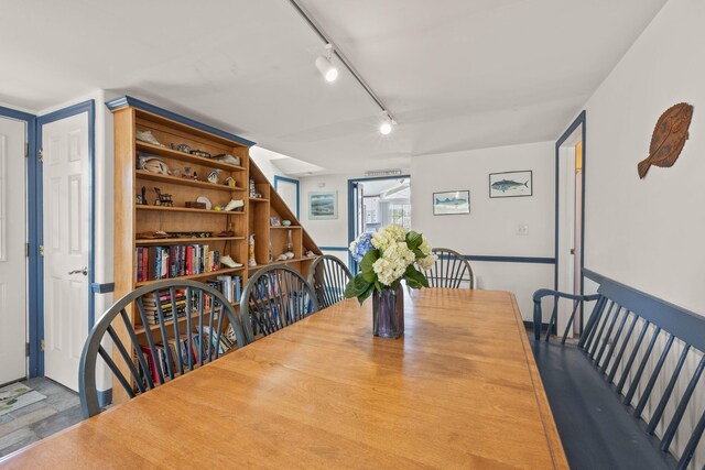 dining room featuring track lighting