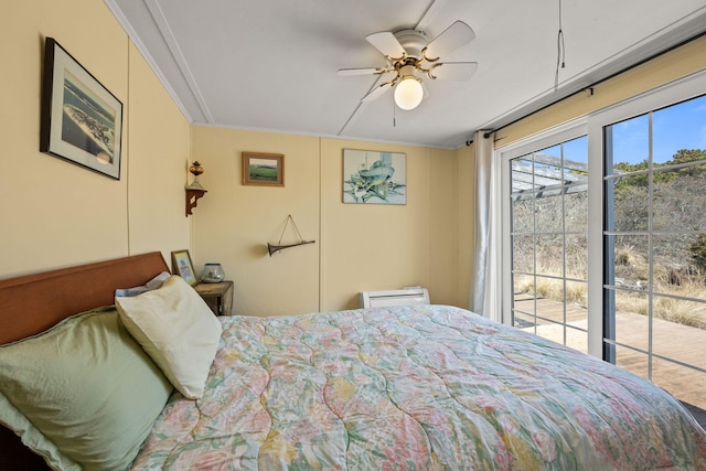 bedroom featuring crown molding, access to exterior, and ceiling fan