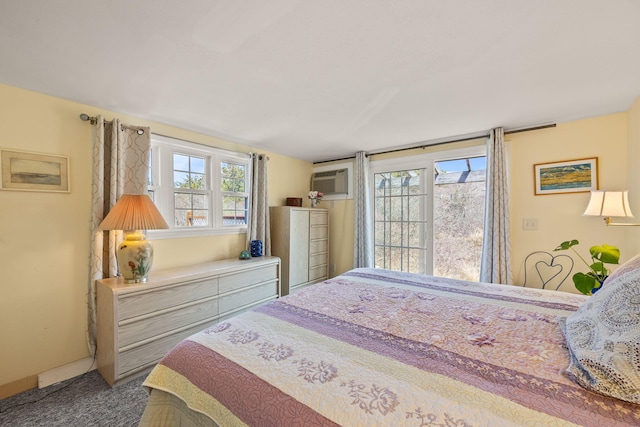 carpeted bedroom with multiple windows