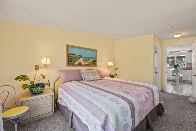 bedroom featuring light colored carpet