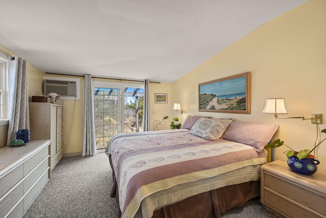 bedroom featuring a wall mounted air conditioner, access to exterior, carpet flooring, baseboards, and lofted ceiling
