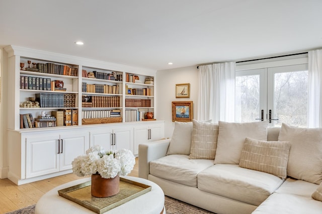 living room featuring recessed lighting, french doors, and light wood finished floors