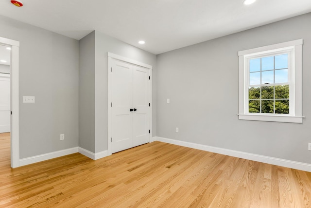 29 Sheppard Rd, Sagamore Beach, MA 02562 - unfurnished bedroom featuring light wood finished floors, baseboards, recessed lighting, and a closet