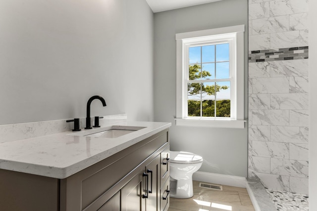 29 Sheppard Rd, Sagamore Beach, MA 02562 - full bath with baseboards, toilet, vanity, tiled shower, and marble finish flooring
