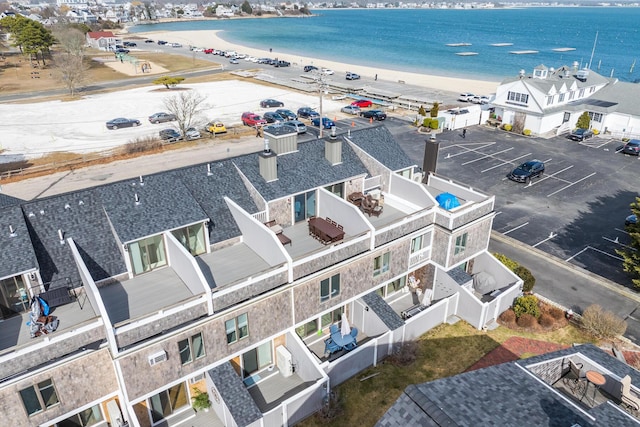 bird's eye view with a water view and a view of the beach