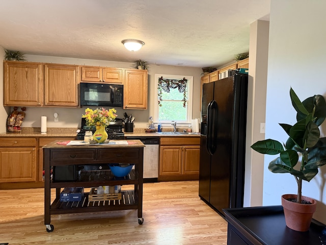 18 Staysail Cir, Marstons Mills, MA 02648 - kitchen featuring black appliances and light wood-style flooring