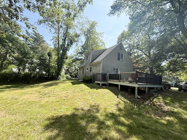 18 Staysail Cir, Marstons Mills, MA 02648 - view of property exterior featuring a deck and a lawn
