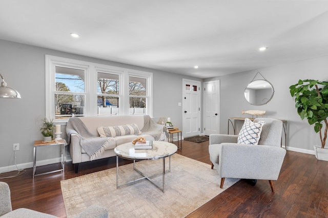 living area with recessed lighting, wood finished floors, and baseboards