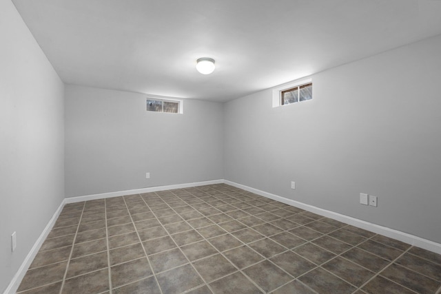 empty room featuring baseboards