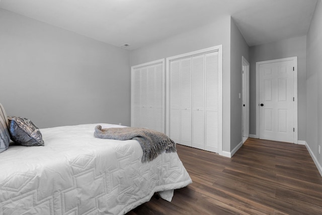 bedroom featuring baseboards and wood finished floors