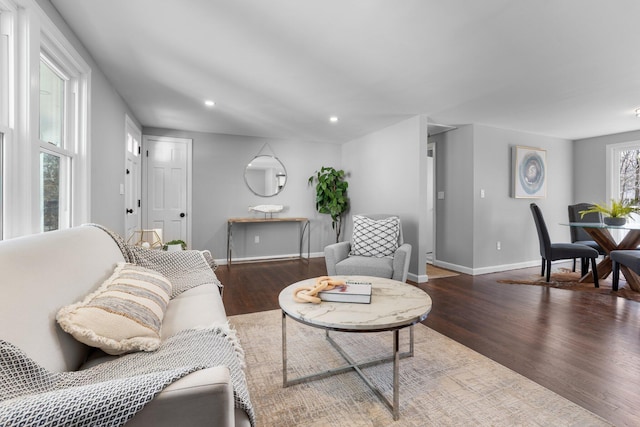 living room with recessed lighting, wood finished floors, and baseboards