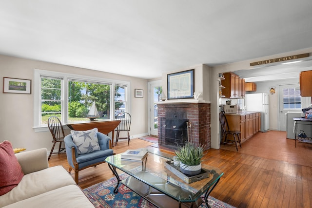 22 Wallace Pt, Buzzards Bay, MA 02532 - living room featuring light wood finished floors, a fireplace, and baseboards