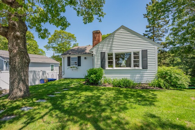 22 Wallace Pt, Buzzards Bay, MA 02532 - rear view of house featuring a chimney