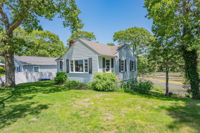 22 Wallace Pt, Buzzards Bay, MA 02532 - view of front facade featuring a chimney and a shingled roof