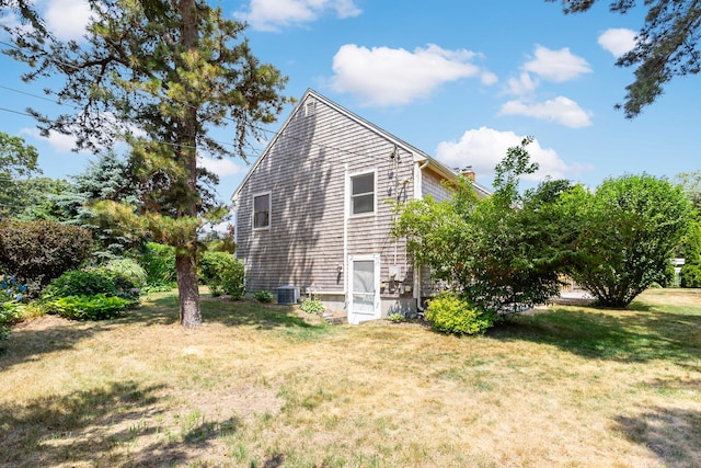 3 Waterside Dr, North Falmouth, MA 02556 - view of home's exterior with a lawn and a chimney
